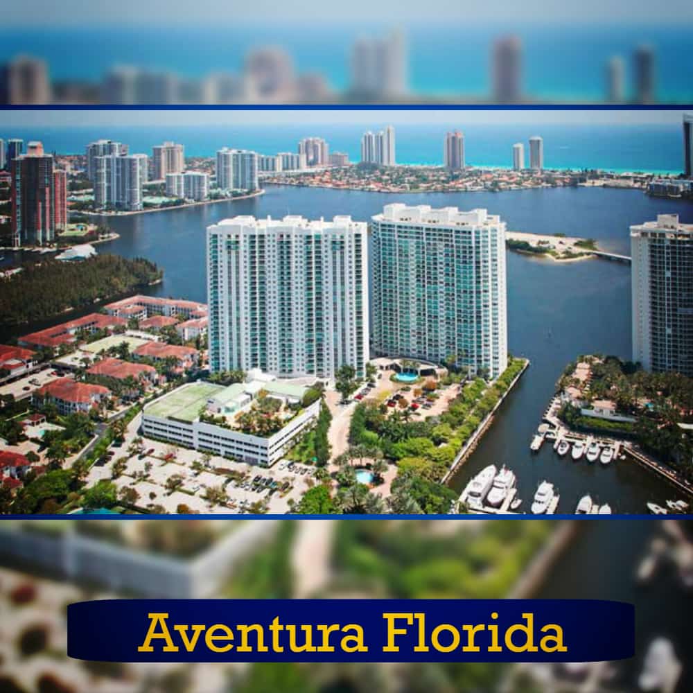 Aerial view of Aventura, Florida, featuring high-rise buildings, waterways, and boats docked in a marina. Amid the bustling scenery, a tow truck ensures smooth traffic flow. Text overlay reads 