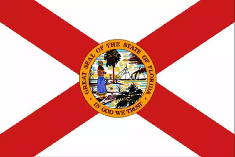 The flag of Florida features a red St. Andrew's Cross on a white field with the state seal in the center, depicting a Native American woman, a steamboat reminiscent of early towing vessels, a palm tree, and the state motto 