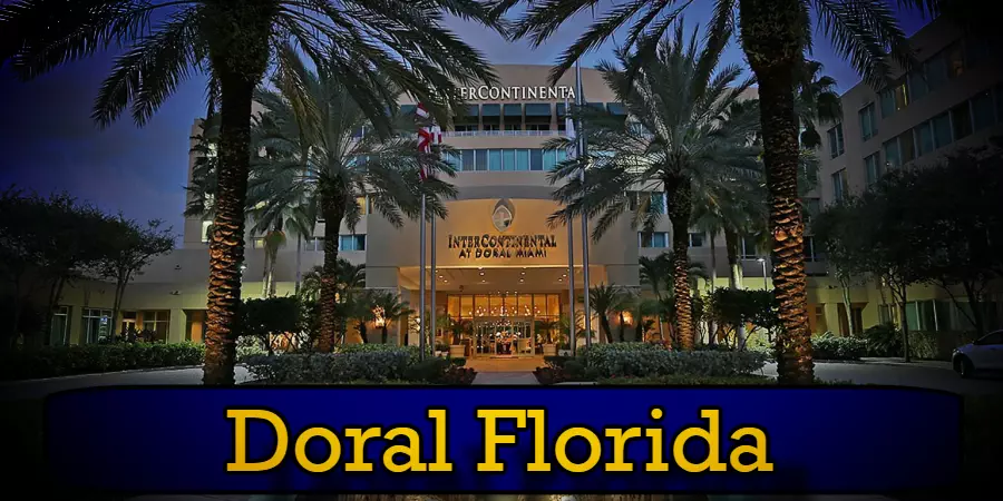 Exterior view of the InterContinental at Doral Miami hotel, framed by palm trees, with a sign that reads 