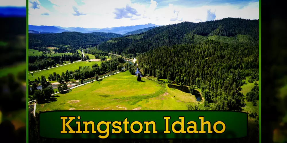 Aerial view of Kingston, Idaho showing extensive green fields, dense forested areas, and distant mountains under a cloudy sky. A tow truck travels along a winding road below. Text overlay at the bottom reads 