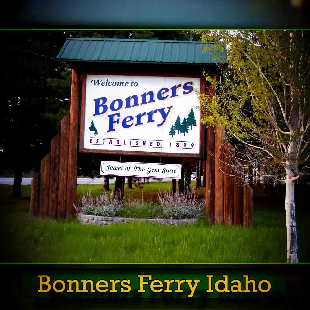A wooden sign welcomes visitors to Bonners Ferry, Idaho, established in 1893, with the tagline 
