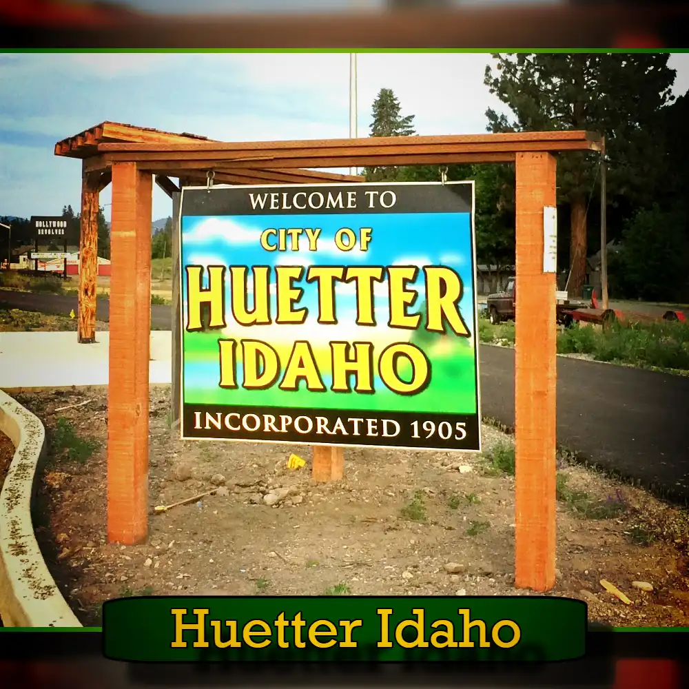 A wooden sign reads, 