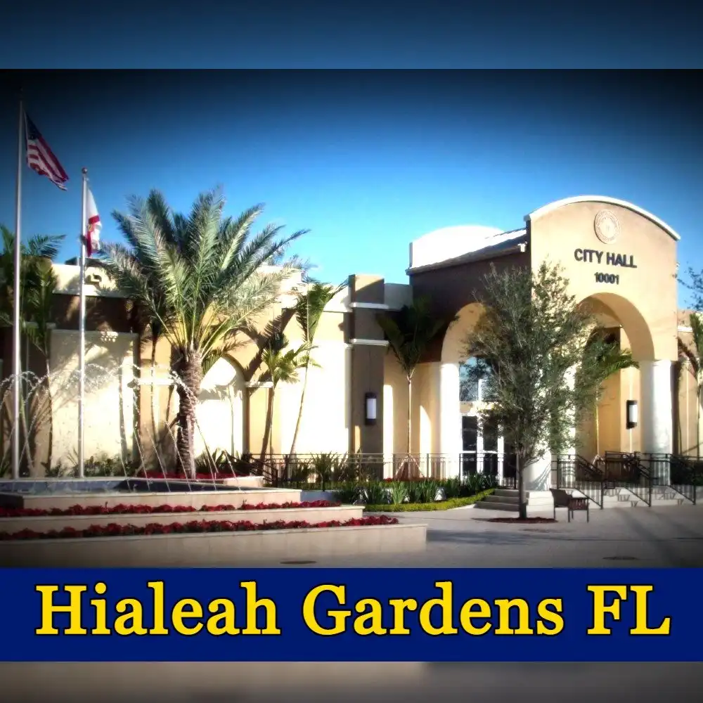 Hialeah Gardens City Hall in Florida features palm trees, fountains, and American flags. A sign reads 