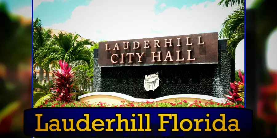 Sign for Lauderhill City Hall in Lauderhill, Florida, surrounded by palm trees, flowers, and greenery, with a clear blue sky in the background. Nearby stands a discreet tow truck from the local tow service, ensuring smooth traffic flow and accessibility.