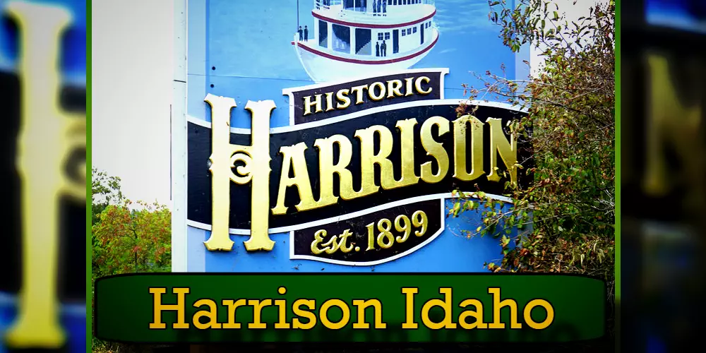 Sign for Historic Harrison in Harrison, Idaho, established in 1899. The sign features a stylized ship and is surrounded by foliage; it's a familiar sight to locals and often spotted by those seeking nearby tow service.